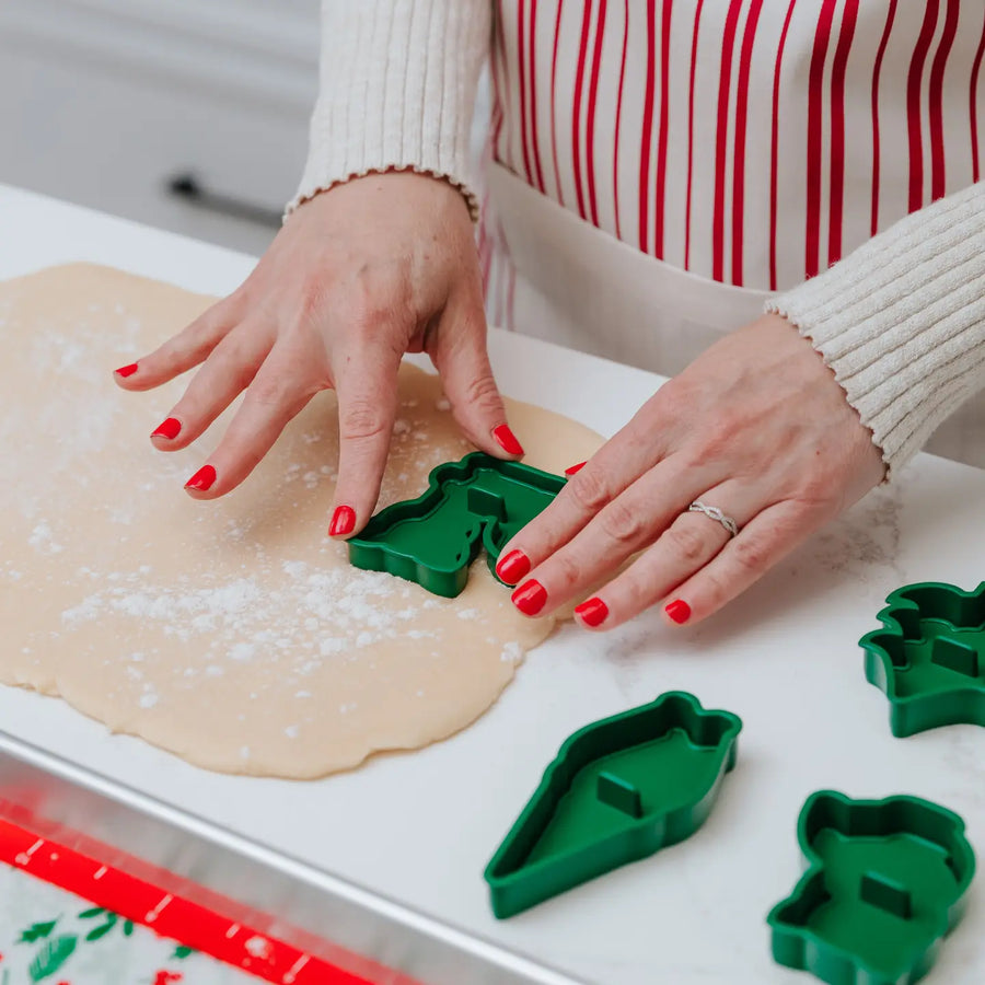 Woman using the fox cookie stamp on a dough from the Woodland cookie baking set